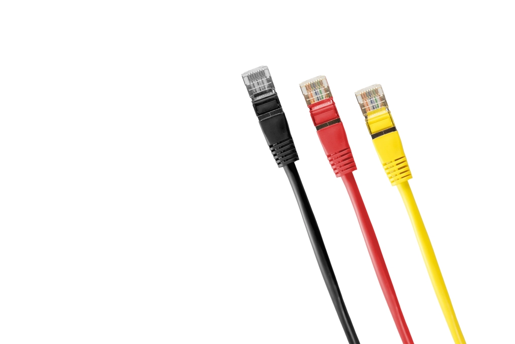 Three ethernet cables in black, red and yellow on a white background