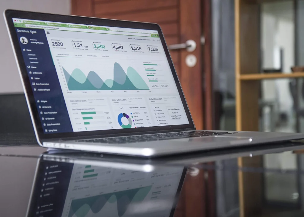 Caching: Laptop showing an analytics dashboard with charts and key metrics