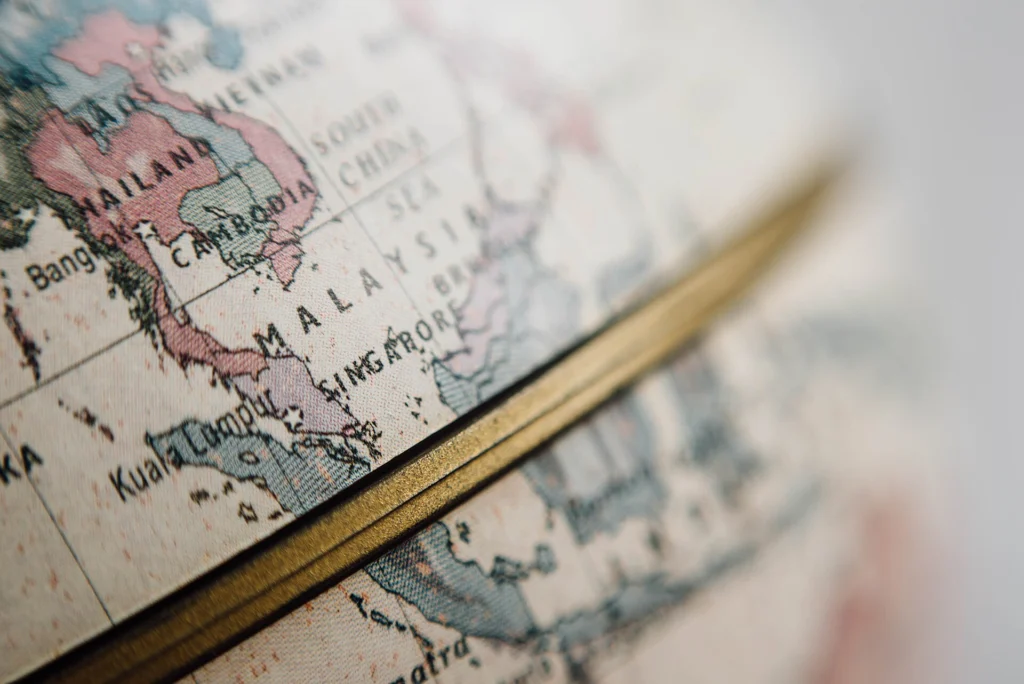 Close-up of a desk globe showing Southeast Asia and the equator line