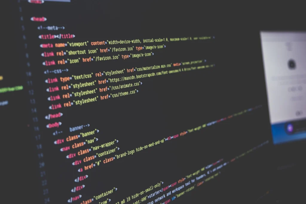 Pipeline: Angled view of HTML source code with syntax highlighting on a dark screen