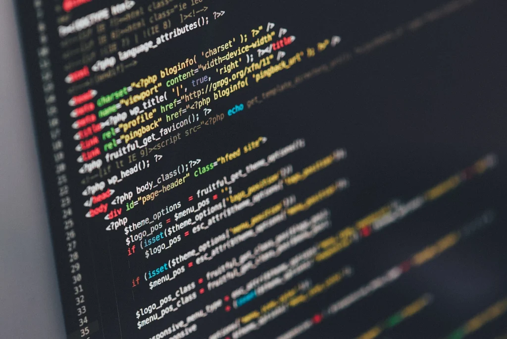 Colorful lines of application code on a dark editor screen