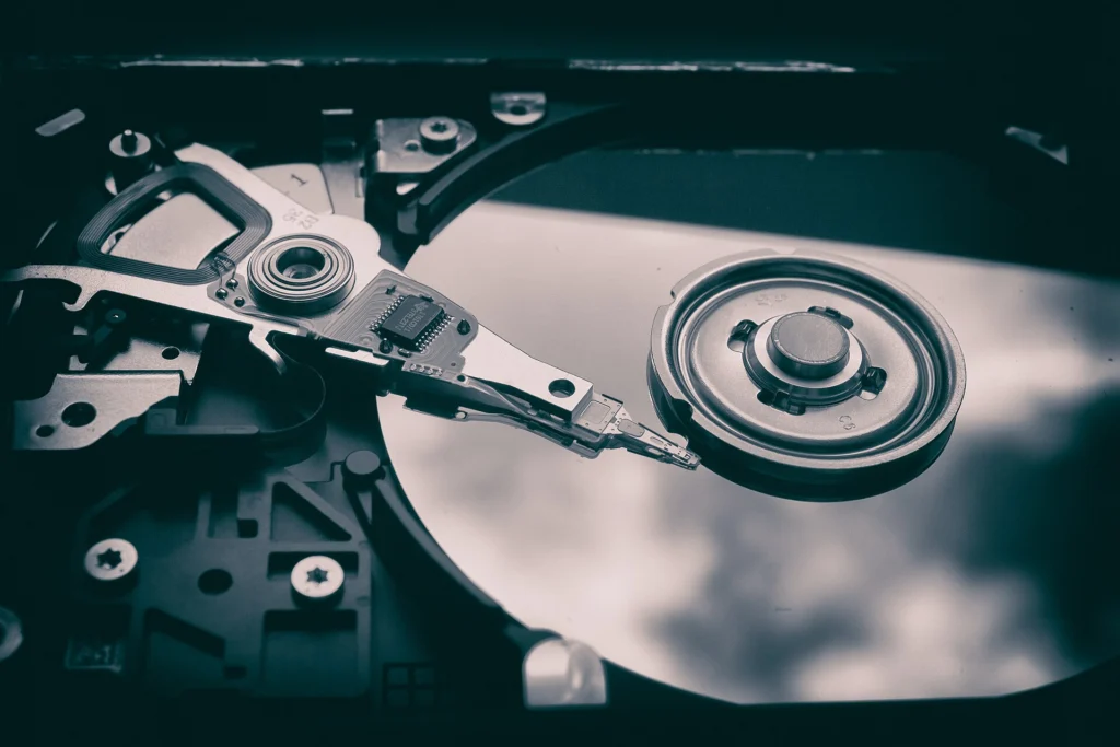 Design: Open hard disk drive showing the platter and read-write head