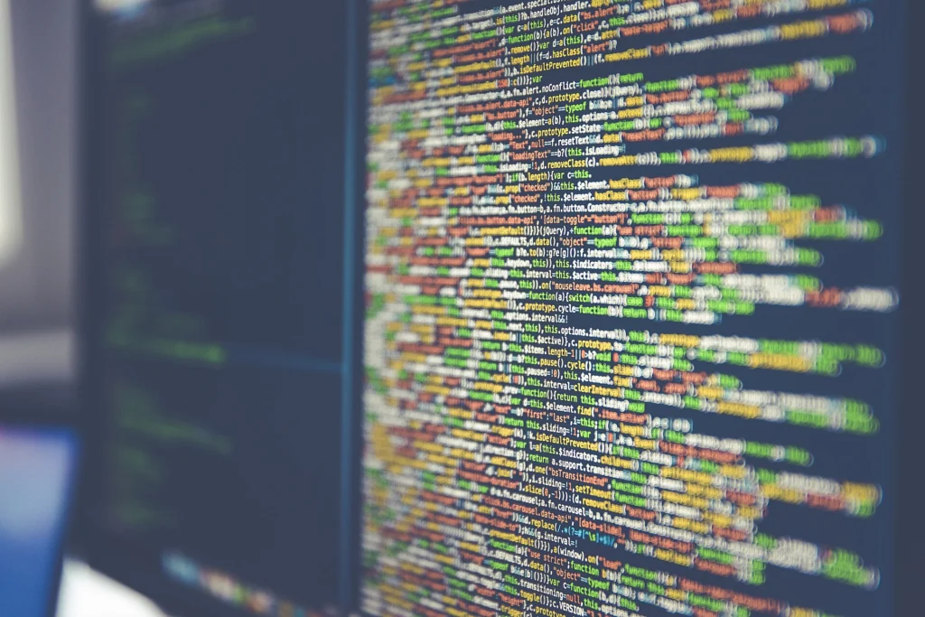 Docker: Close-up of colorful source code displayed on a computer monitor