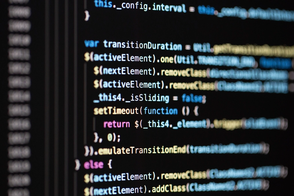 Close-up of JavaScript code with functions and callbacks on a dark screen
