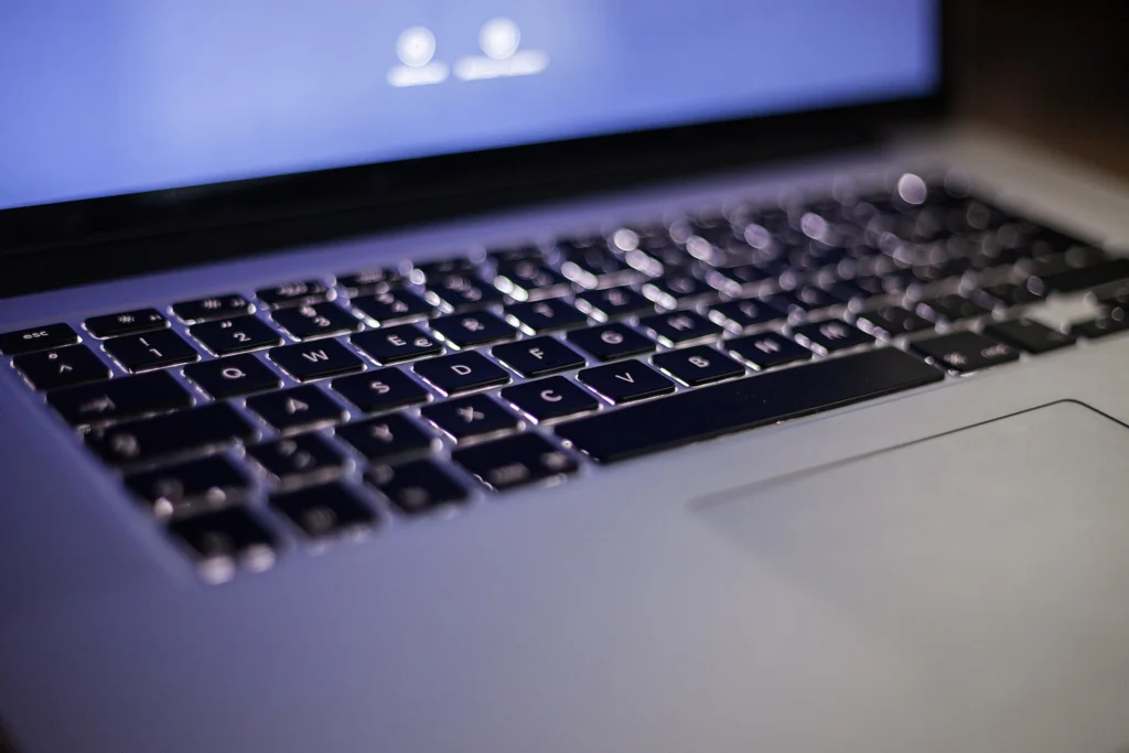 Accessibility: Close-up of a backlit laptop keyboard and trackpad