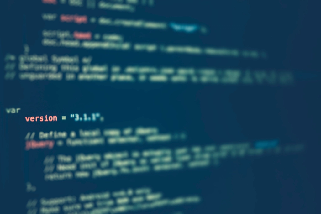 Close-up of source code with a version variable on a dark blue screen