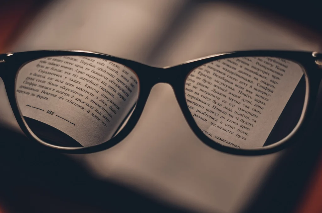 Printed text magnified and sharpened through a pair of glasses