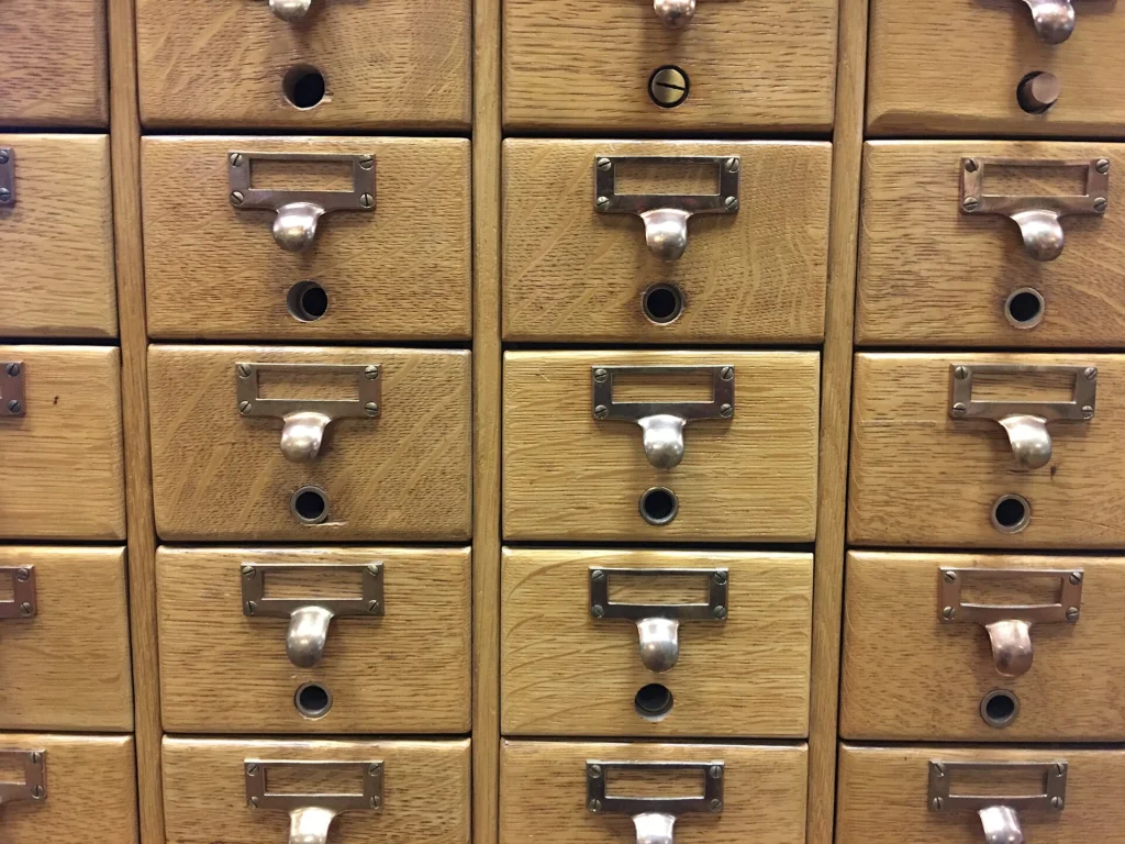 Technical SEO: Wooden library card catalog with rows of labeled drawers