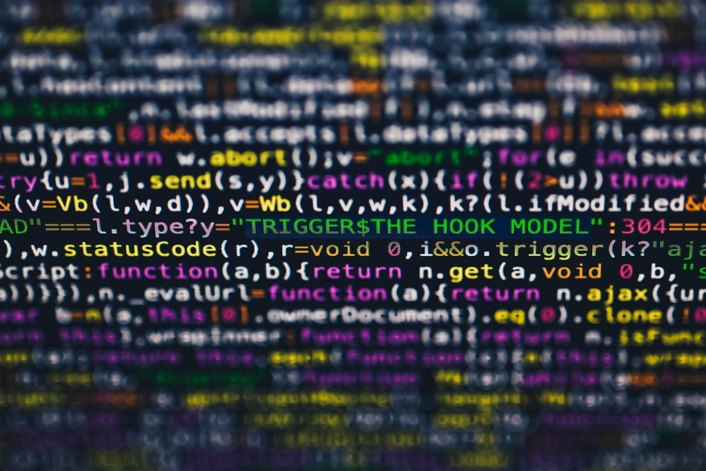Colorful program code with status checks shown on a monitor