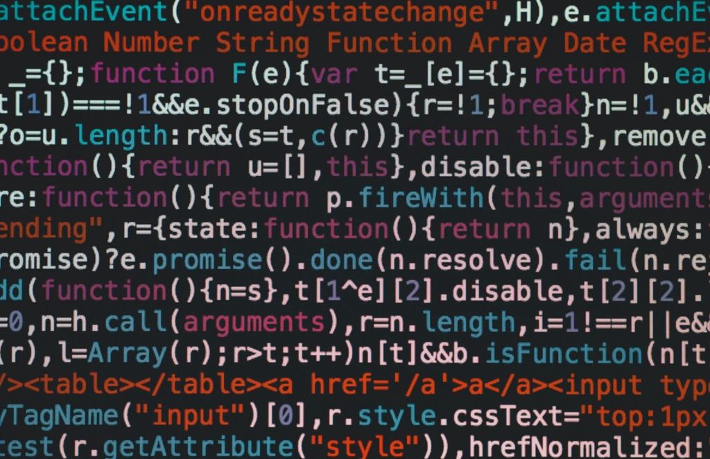 Scraping: JavaScript and HTML source code on a dark screen in close-up