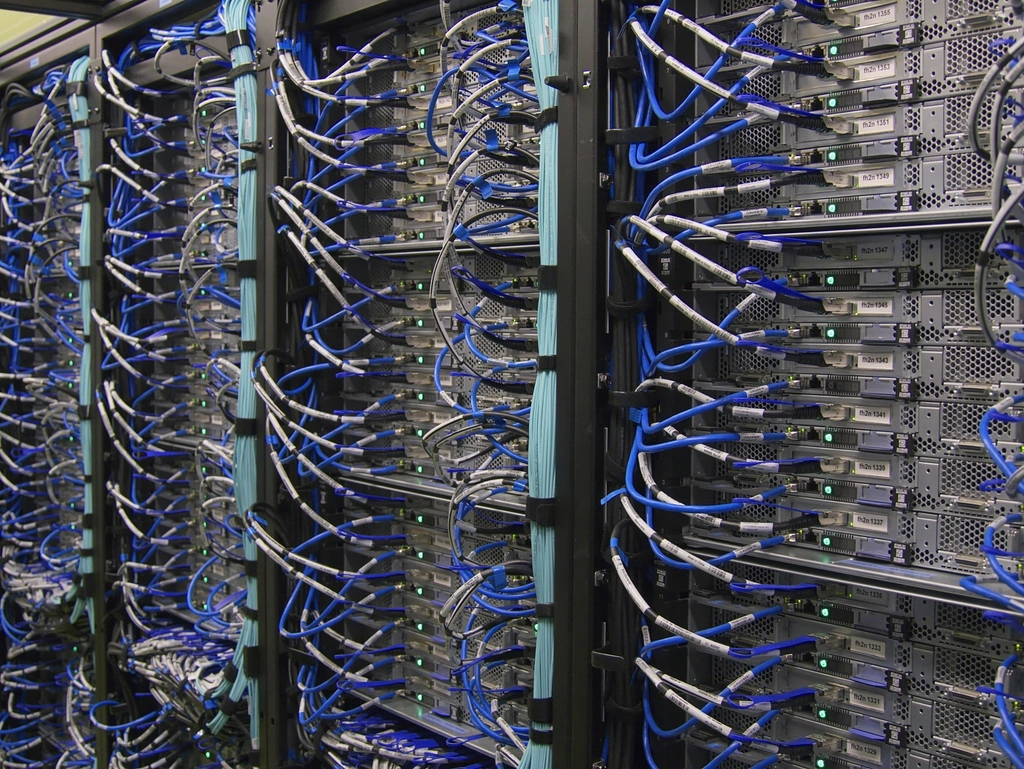 Code: Server racks with neatly routed blue and white network cables