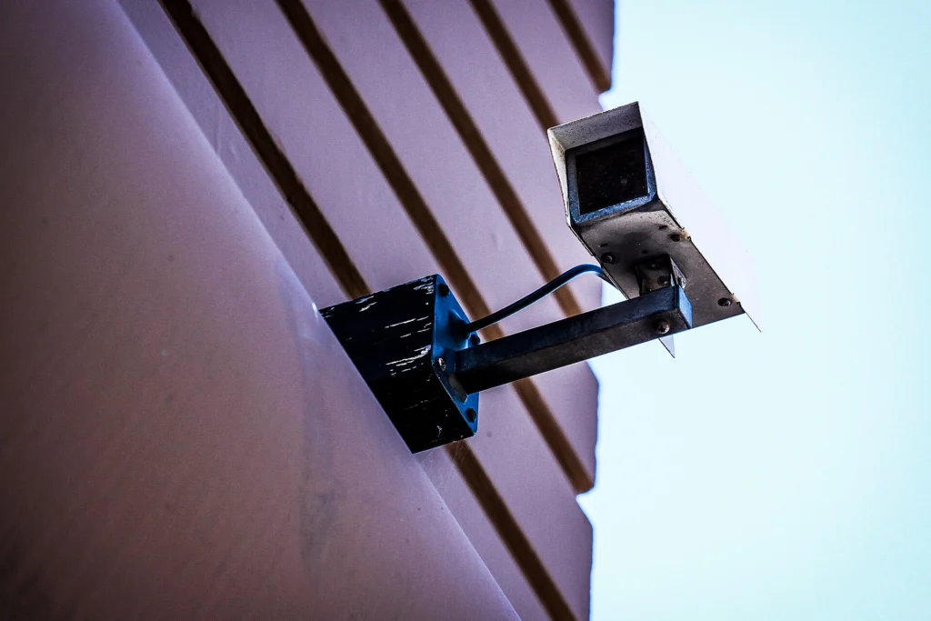 Security camera mounted on the side of a building